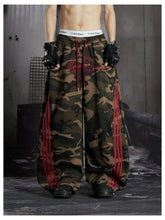 NOMANIAI Street-style embroidered camouflage casual pants with three-stripe detailing.