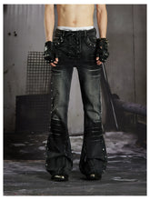 NOMANIAI Distressed, slim-fit, slight-flare jeans with studs—dark streetwear style.