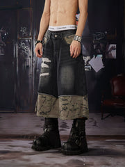 NOMANIAI Loose-fit, cropped pants featuring a "faux-layered" design, camouflage print, and a washed, distressed finish.