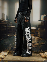 NOMANIAI Coated Loose-Fit Jeans with Large Letter Print.