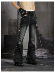 NOMANIAI Distressed, slim-fit, slight-flare jeans with studs—dark streetwear style.