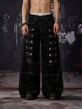 NOMANIAI Y2K-style straight-leg jeans featuring large, dimensional square studs and a distinctive look.