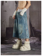 NOMANIAI Loose-fit cropped jeans with rhinestone embellishments.