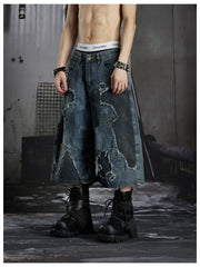 NOMANIAI Distressed, raw-edge, deconstructed loose-fit denim shorts Cropped trousers.