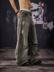 NOMANIAI Distressed, washed, and vintage-look loose wide-leg jeans.