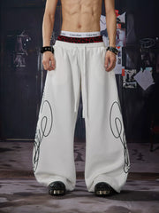 NOMANIAI Y2K-style loose-fit casual pants with leopard print and totem motifs.