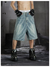 NOMANIAI Loose-fit cropped jeans with rhinestone embellishments.