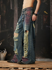 NOMANIAI Distressed jeans with a double-waistband design and cutouts.