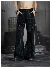 NOMANIAI Edgy, dark-style street-look flared jeans with paint-splatter and stud details.