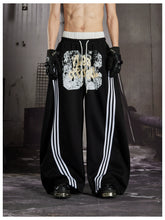 NOMANIAI Y2K Graffiti-Print Casual Pants with Double-Layer Waistband and Three-Stripe Detail.