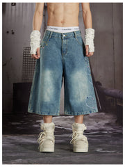 NOMANIAI Cropped jeans with rhinestone and embroidery totem design.