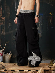 NOMANIAI Leopard-print double-waistband panelled cotton cargo pants.
