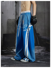 NOMANIAI Street-style distressed print loose-fit sweatpants.
