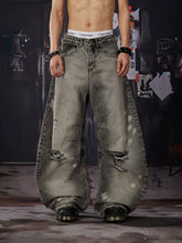 NOMANIAI Distressed, washed, and vintage-look loose wide-leg jeans.