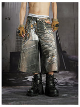 NOMANIAI Loose-fit cropped trousers featuring a 3D-printed plaid pattern and chain detailing.
