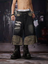 NOMANIAI Loose-fit, cropped pants featuring a "faux-layered" design, camouflage print, and a washed, distressed finish.