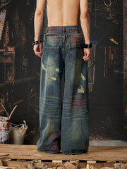 NOMANIAI Distressed jeans with a double-waistband design and cutouts.