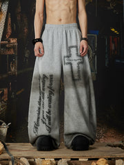 NOMANIAI Elastic-waist casual curved-leg trousers with cross-motif print.