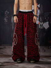 NOMANIAI Y2K-style loose-fit casual pants with leopard print and totem motifs.