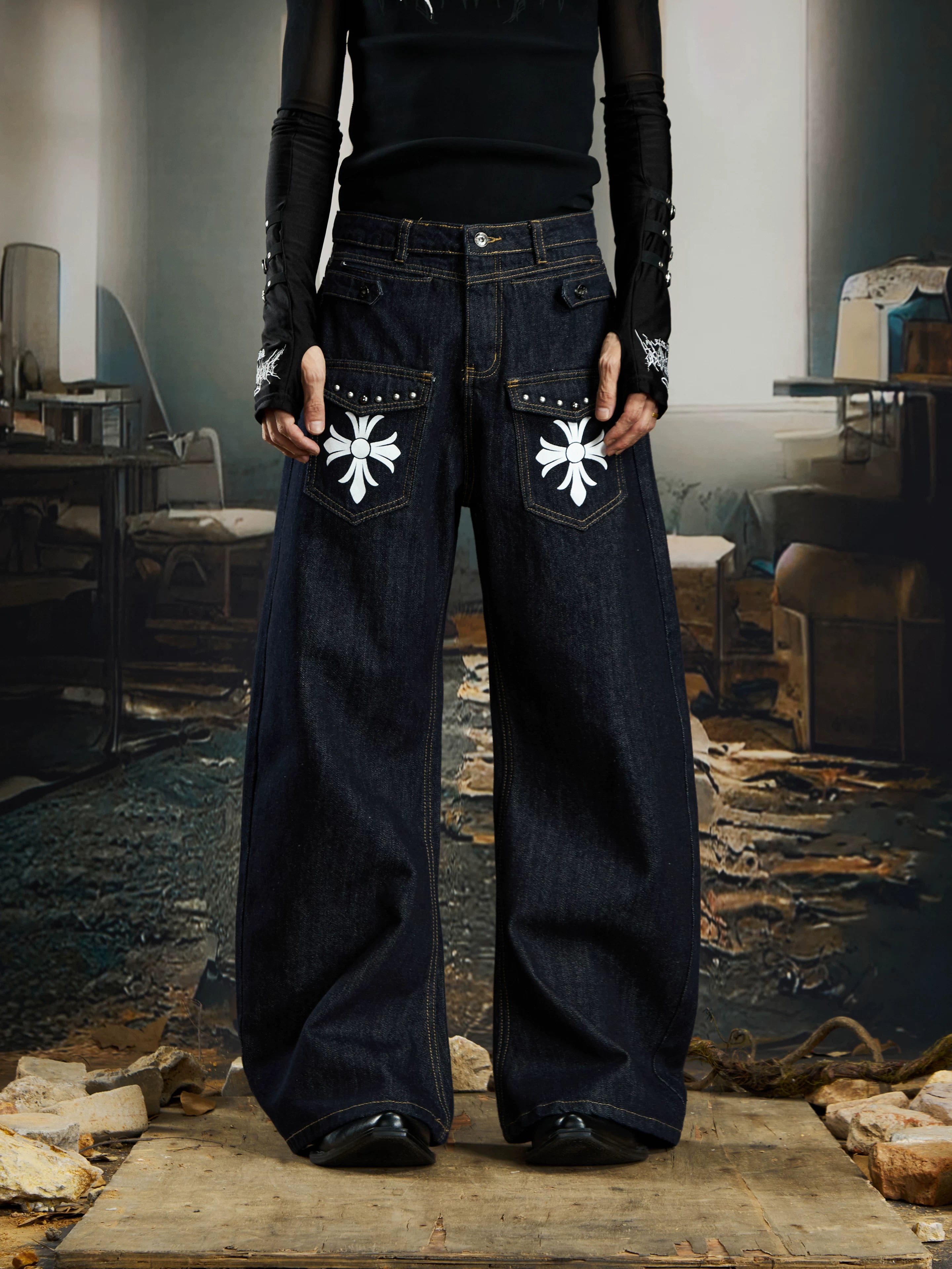 NOMANIAI  Printed, studded, deconstructed "Scimitar" jeans—versatile trousers.
