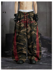 NOMANIAI Street-style embroidered camouflage casual pants with three-stripe detailing.