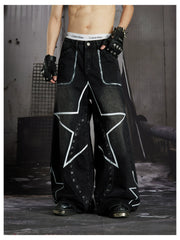 NOMANIAI  Hand-painted star and stud detail wide-leg jeans with a washed, distressed finish.