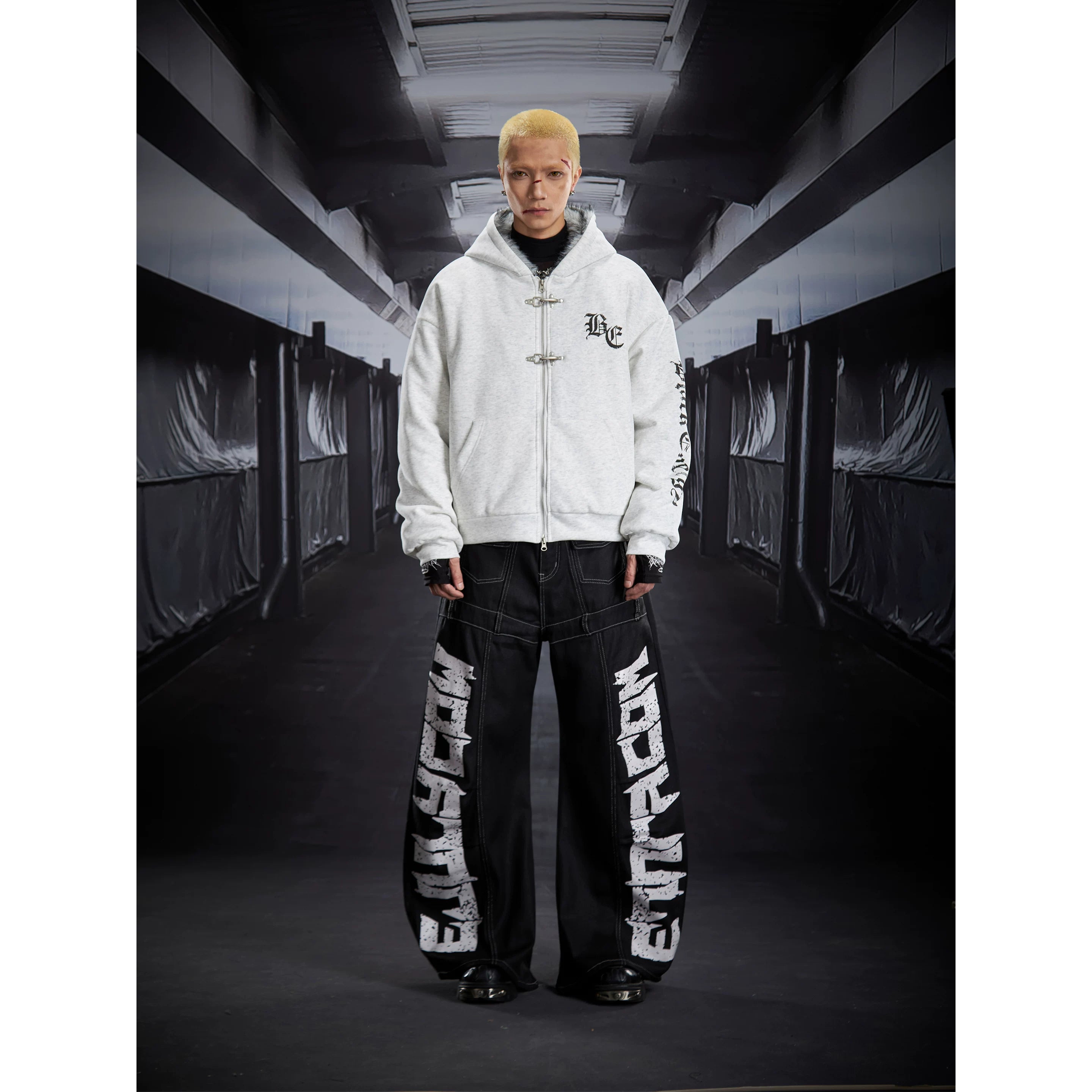 NOMANIAI Coated Loose-Fit Jeans with Large Letter Print.