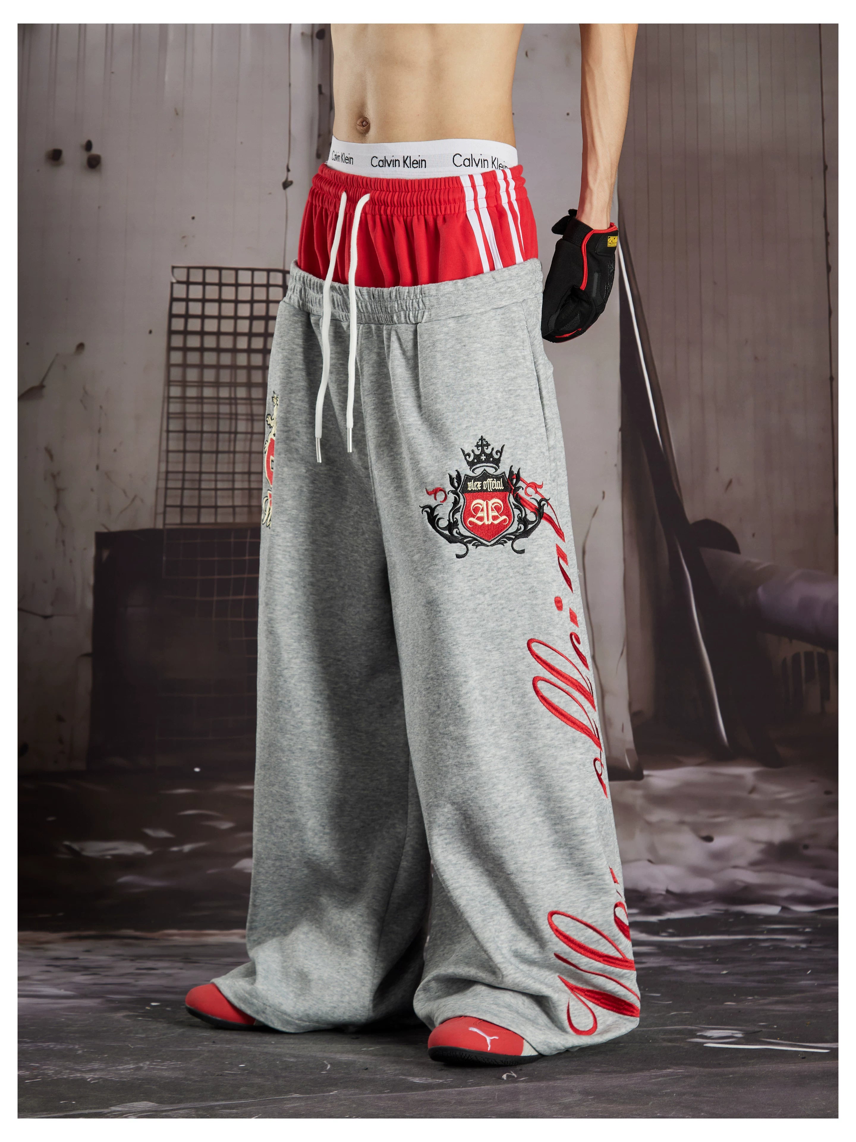 NOMANIAI  Street-style loose-fit casual trousers with double-waistband embroidery.