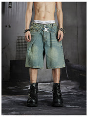 NOMANIAI Deconstructed double-waistband distressed loose-fit denim shorts.