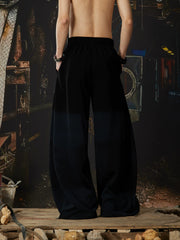 NOMANIAI Elastic-waist casual curved-leg trousers with cross-motif print.