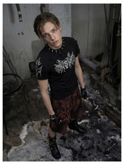 NOMANIAI Y2K loose-fit denim shorts with hand-drawn motifs and studs.