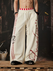 NOMANIAI  Printed Y2K loose-fit casual pants with double-waistband detail.