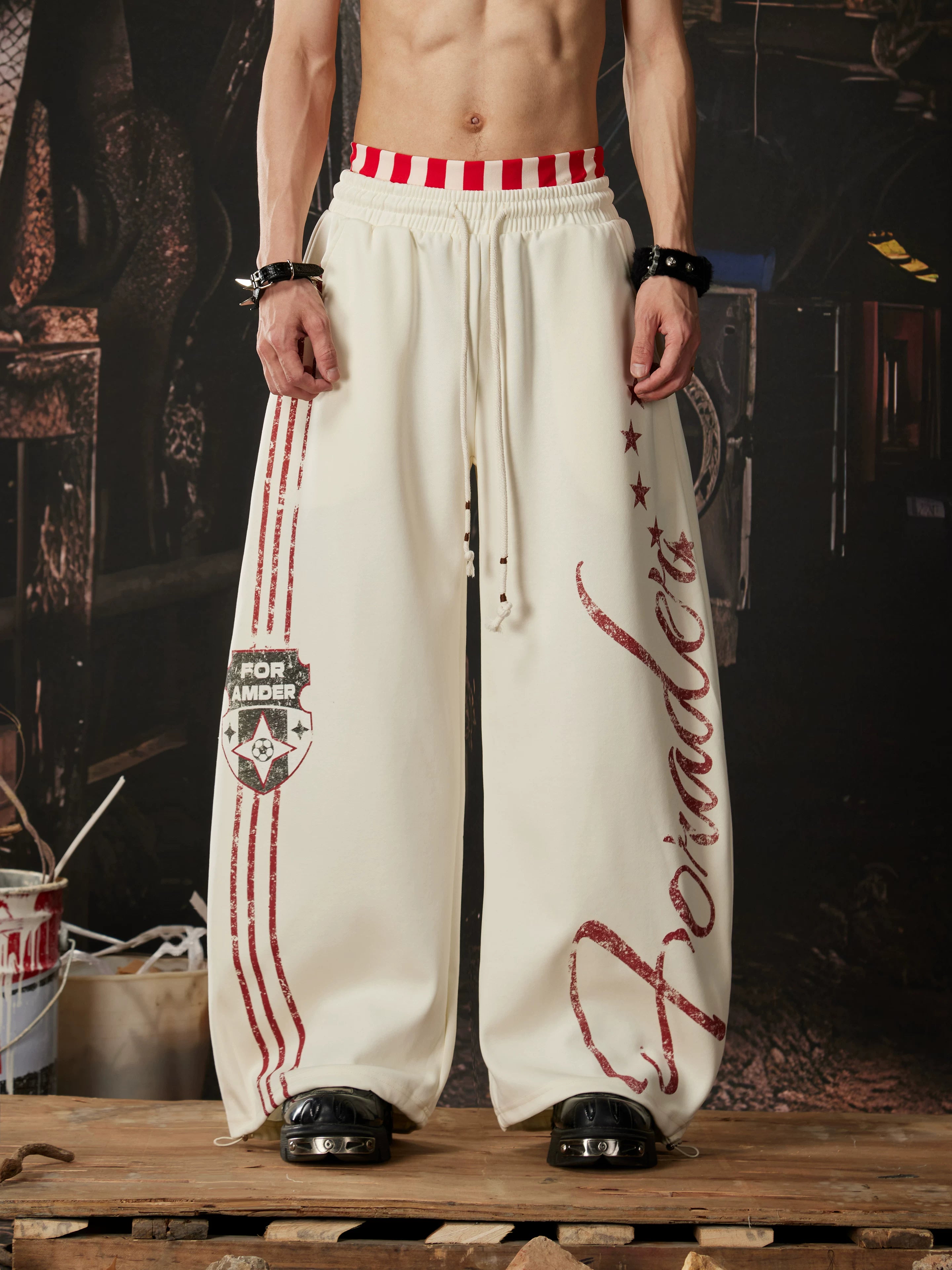 NOMANIAI  Printed Y2K loose-fit casual pants with double-waistband detail.