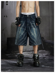 NOMANIAI Loose-fit cropped jeans with rhinestone embellishments.