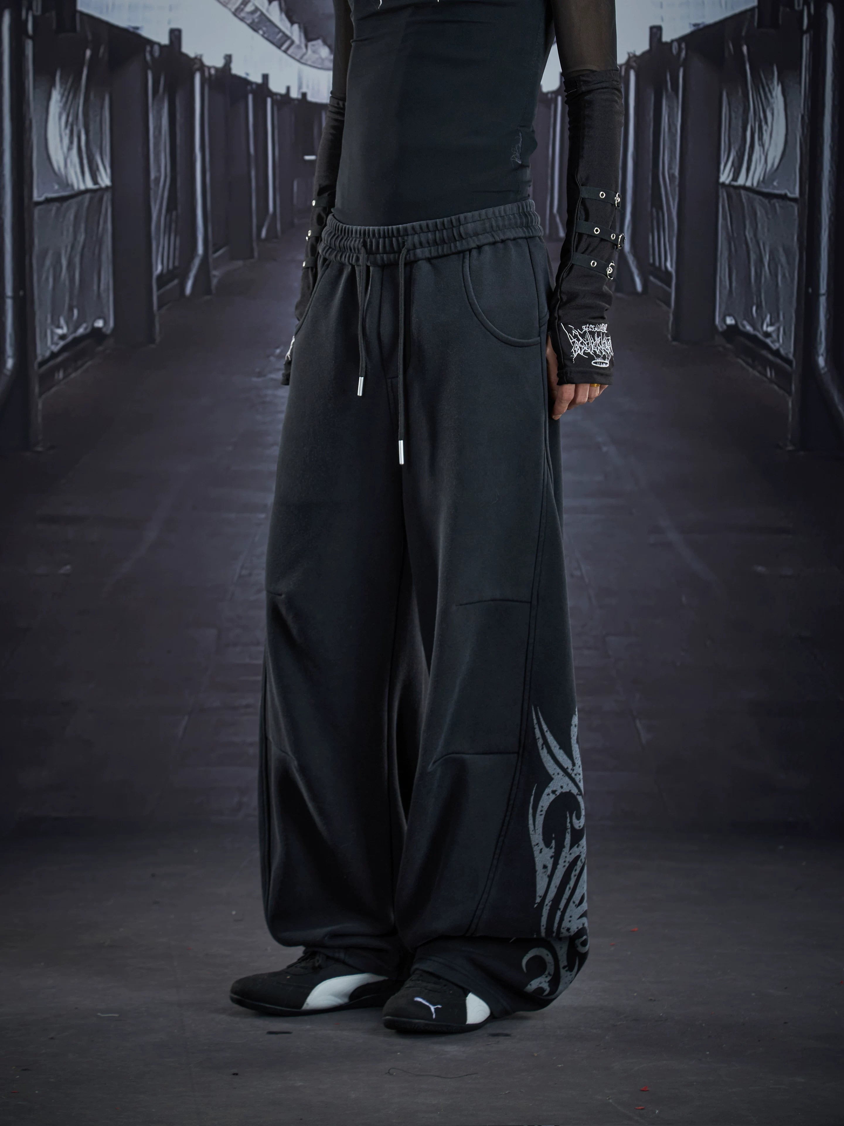 NOMANIAI  Loose-fit casual trousers with a washed, distressed finish and totem print.