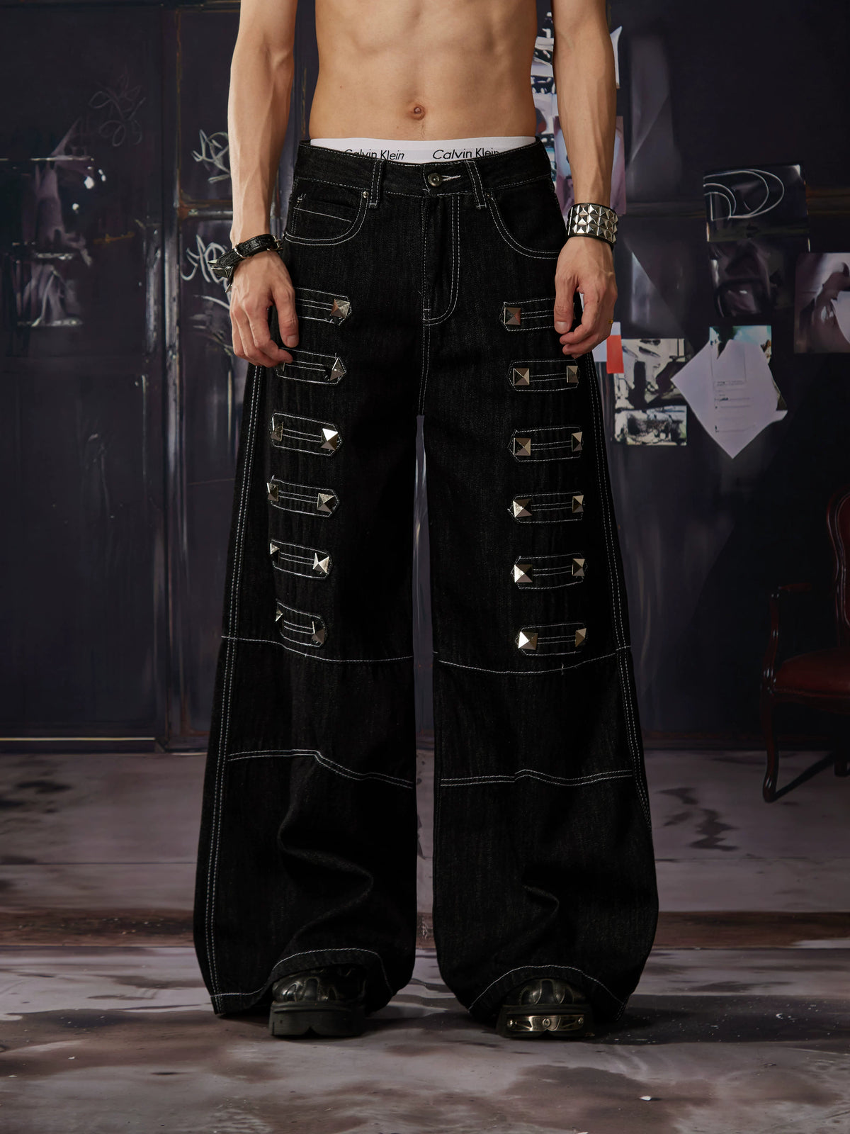 NOMANIAI Y2K-style straight-leg jeans featuring large, dimensional square studs and a distinctive look.