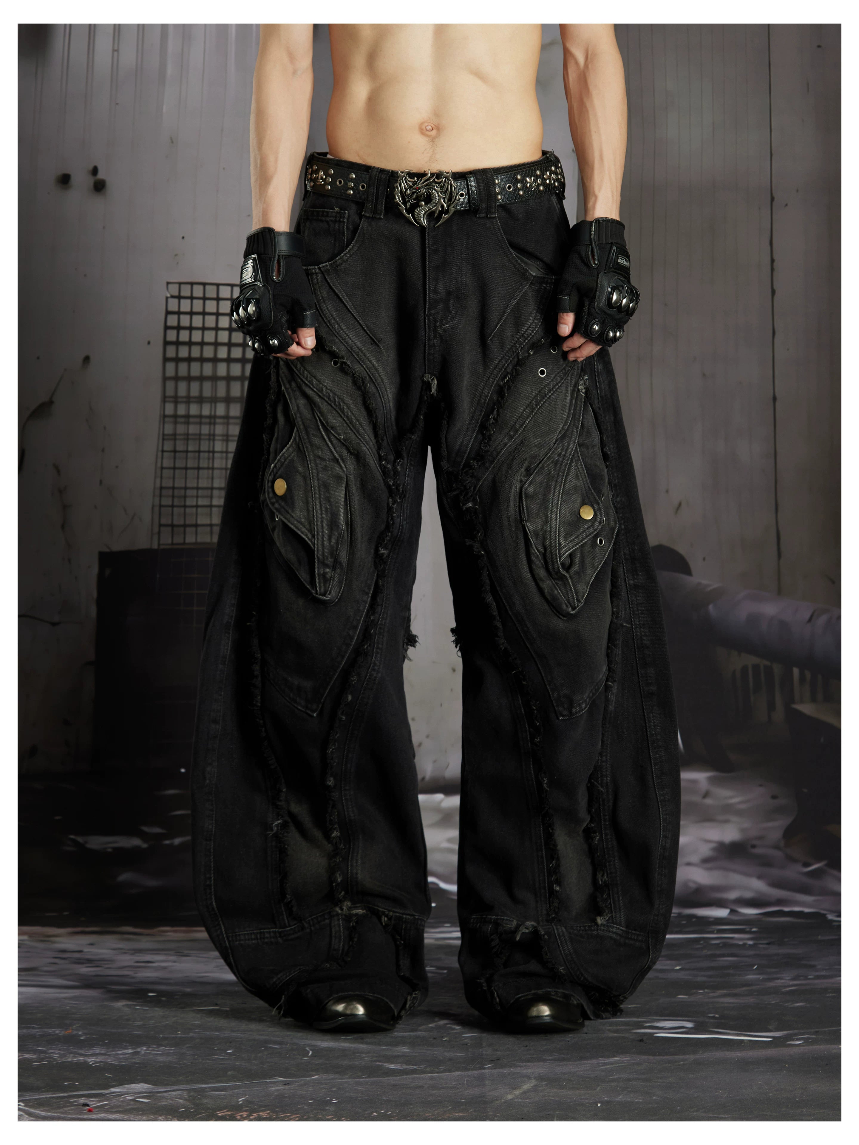 NOMANIAI  Heavy-duty distressed loose-fit curved-seam jeans.