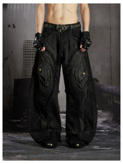 NOMANIAI  Heavy-duty distressed loose-fit curved-seam jeans.