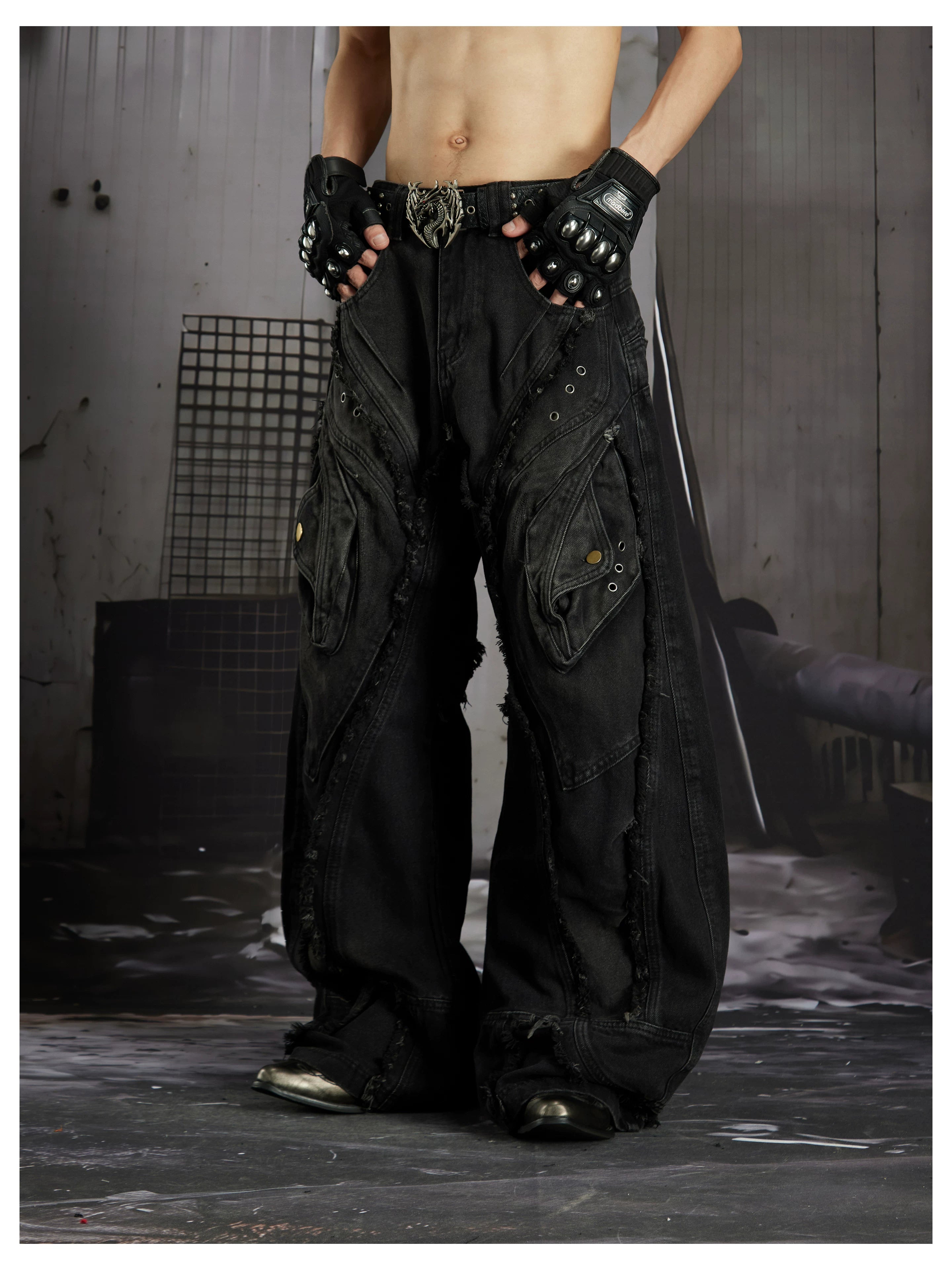 NOMANIAI  Heavy-duty distressed loose-fit curved-seam jeans.