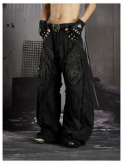 NOMANIAI  Heavy-duty distressed loose-fit curved-seam jeans.