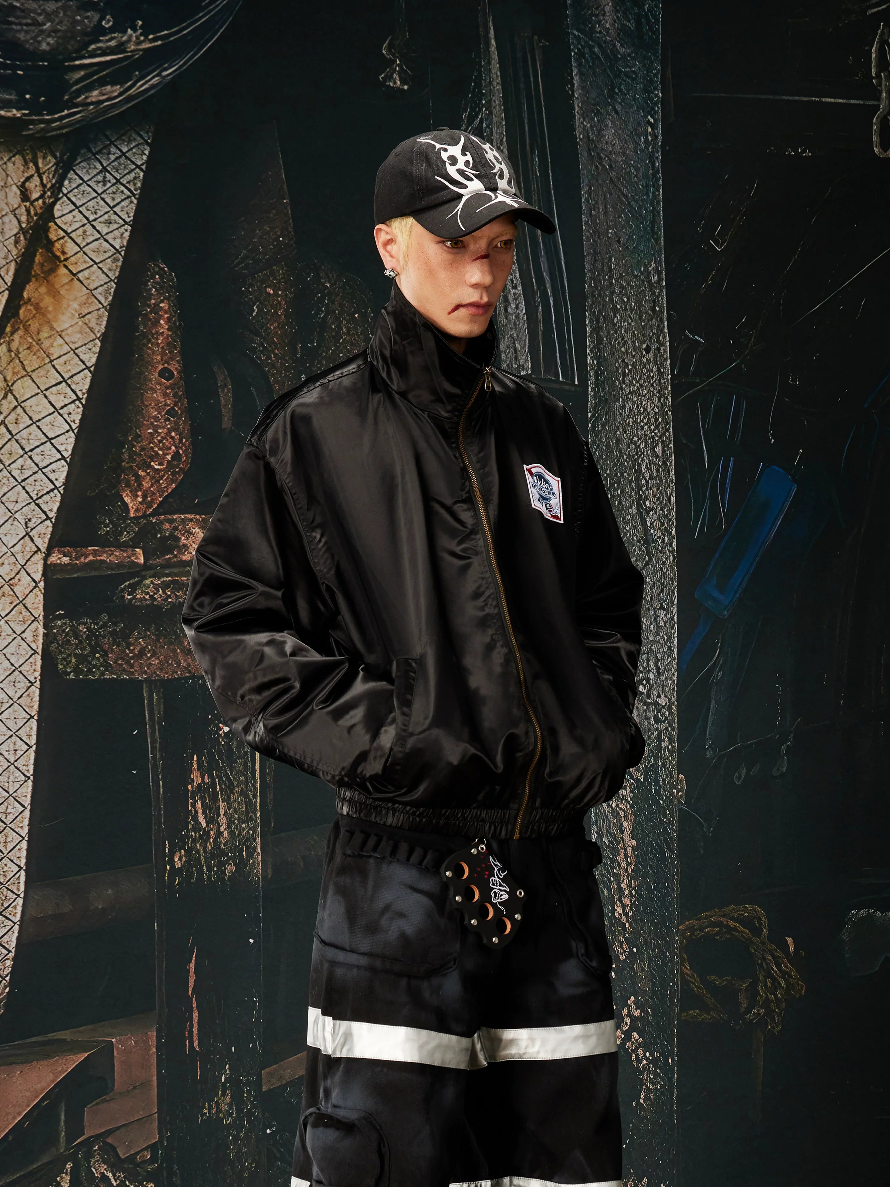 NOMANIAI Glossy-finish custom embroidered zip-up jacket.