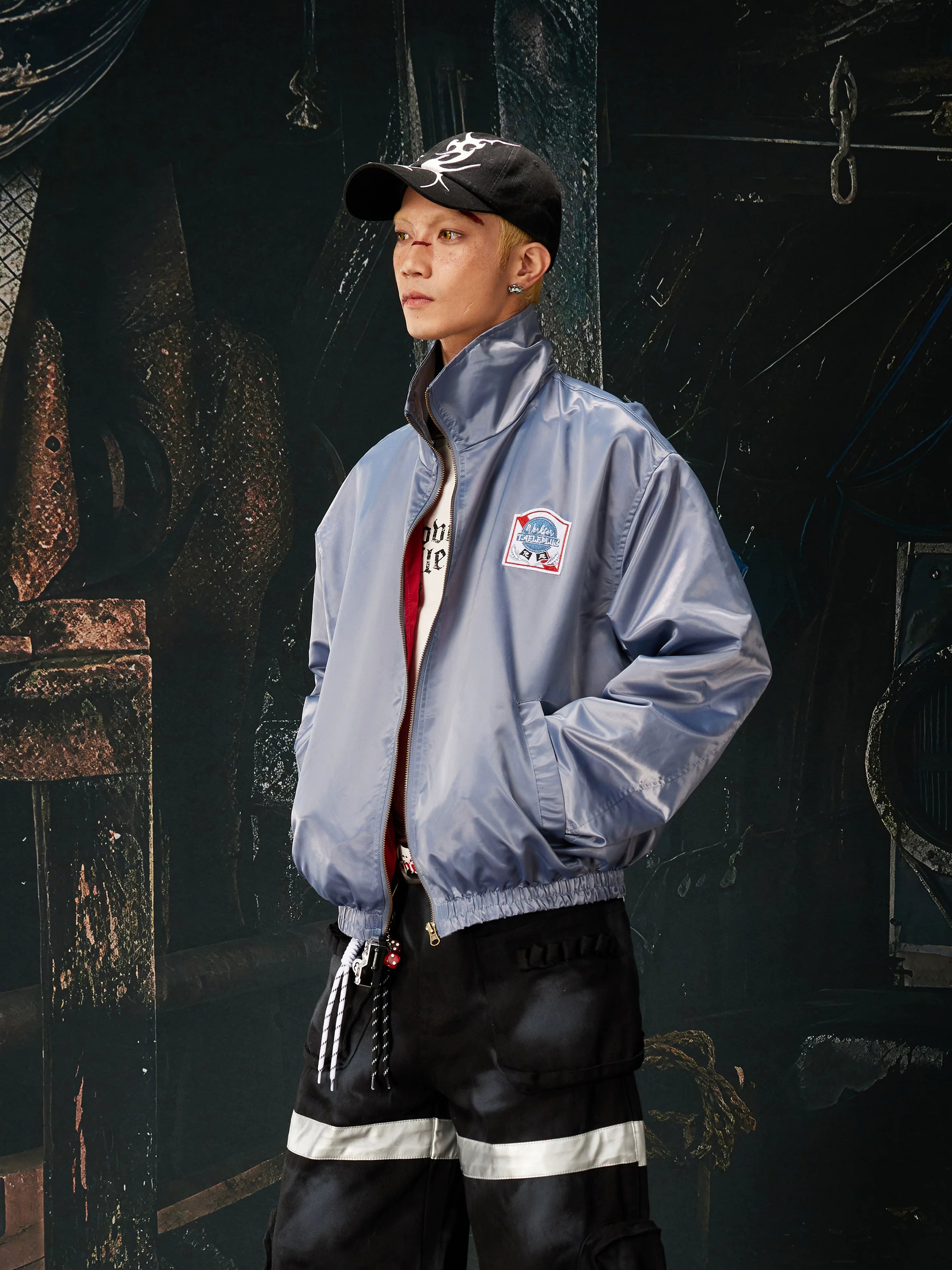 NOMANIAI Glossy-finish custom embroidered zip-up jacket.