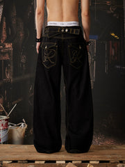 NOMANIAI  Embroidered-waistband loose-fit jeans.