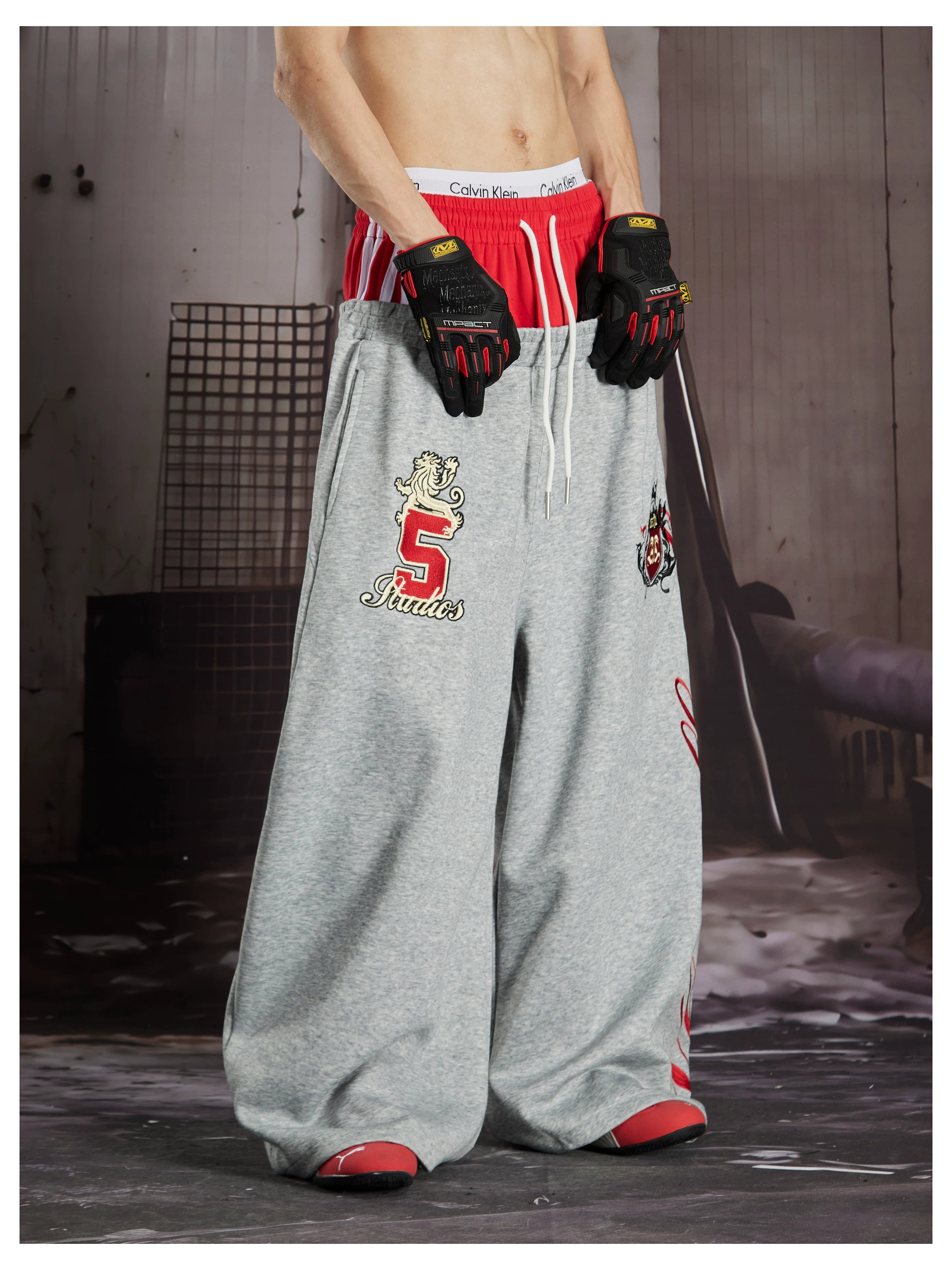 NOMANIAI  Street-style loose-fit casual trousers with double-waistband embroidery.