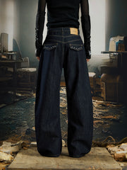 NOMANIAI  Printed, studded, deconstructed "Scimitar" jeans—versatile trousers.