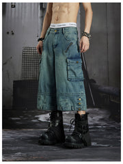 NOMANIAI  Washed, distressed, loose-fit cropped pants with multiple pockets.