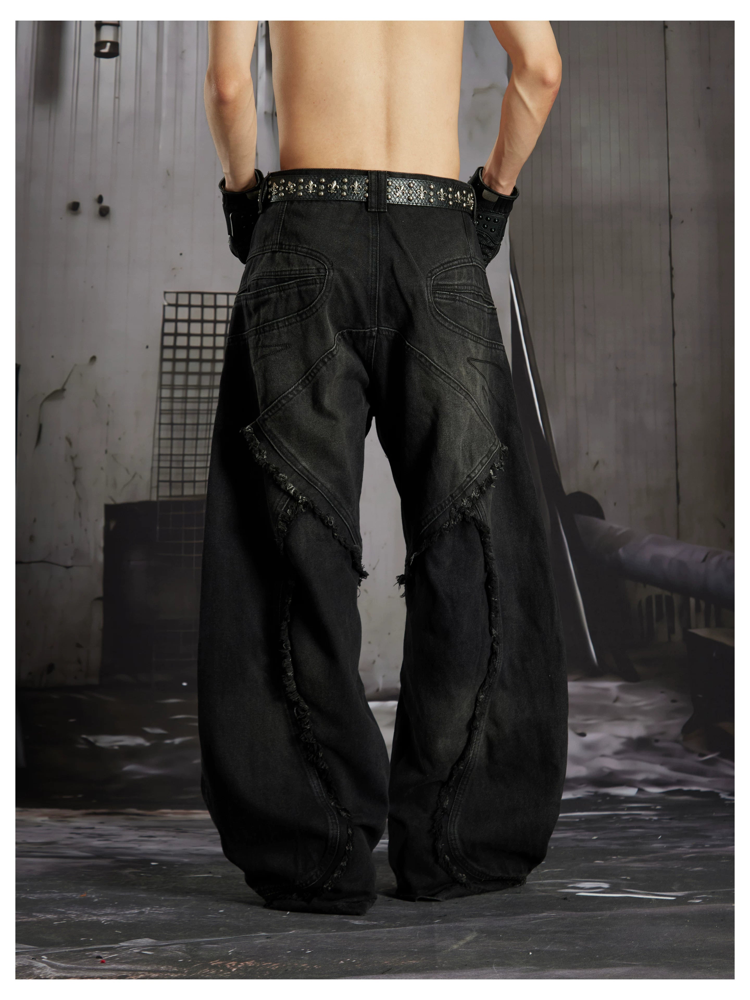 NOMANIAI  Heavy-duty distressed loose-fit curved-seam jeans.