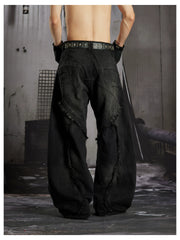 NOMANIAI  Heavy-duty distressed loose-fit curved-seam jeans.