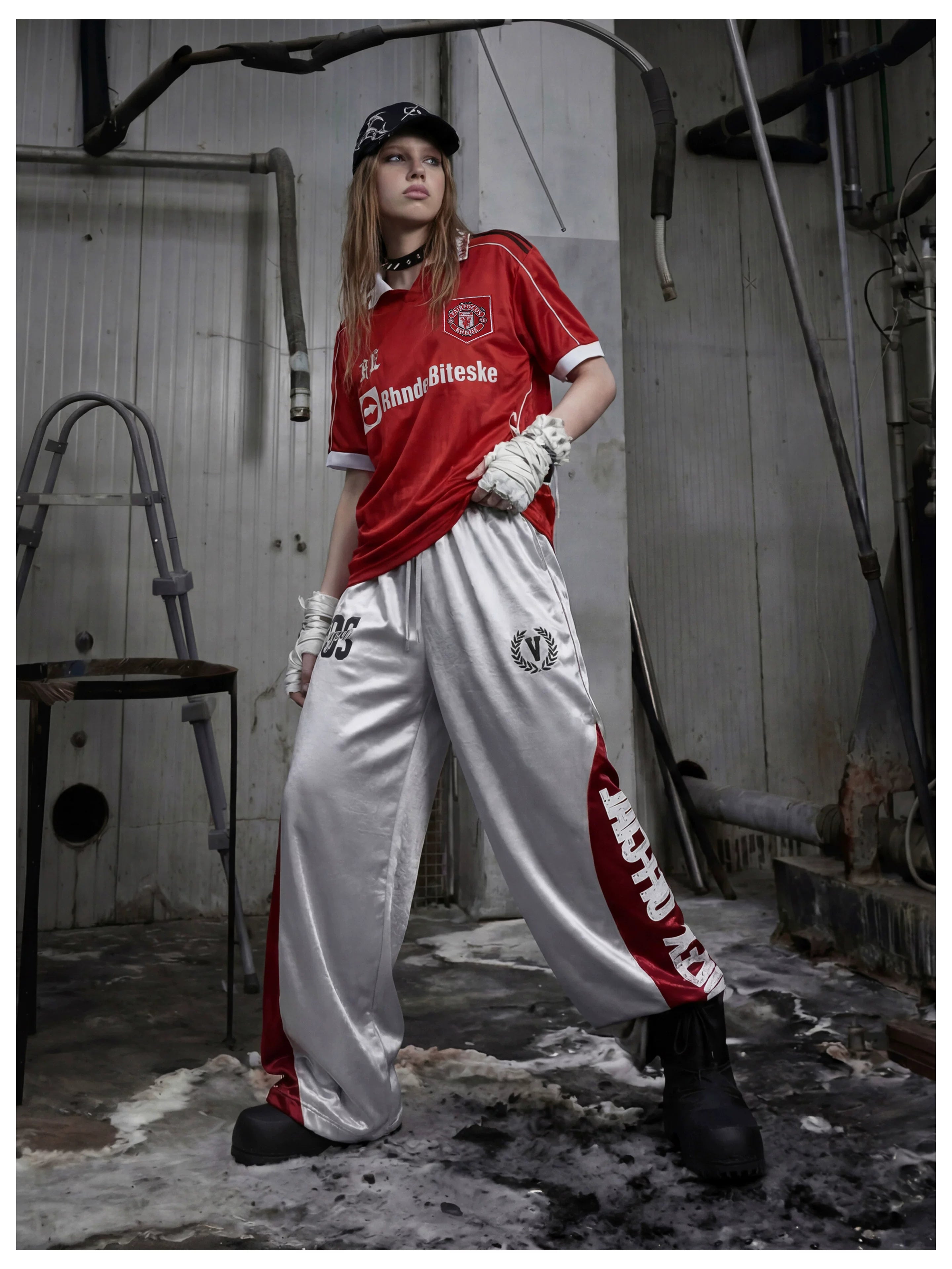 NOMANIAI Street-style casual pants featuring a draped fit, paneling, and a print design.