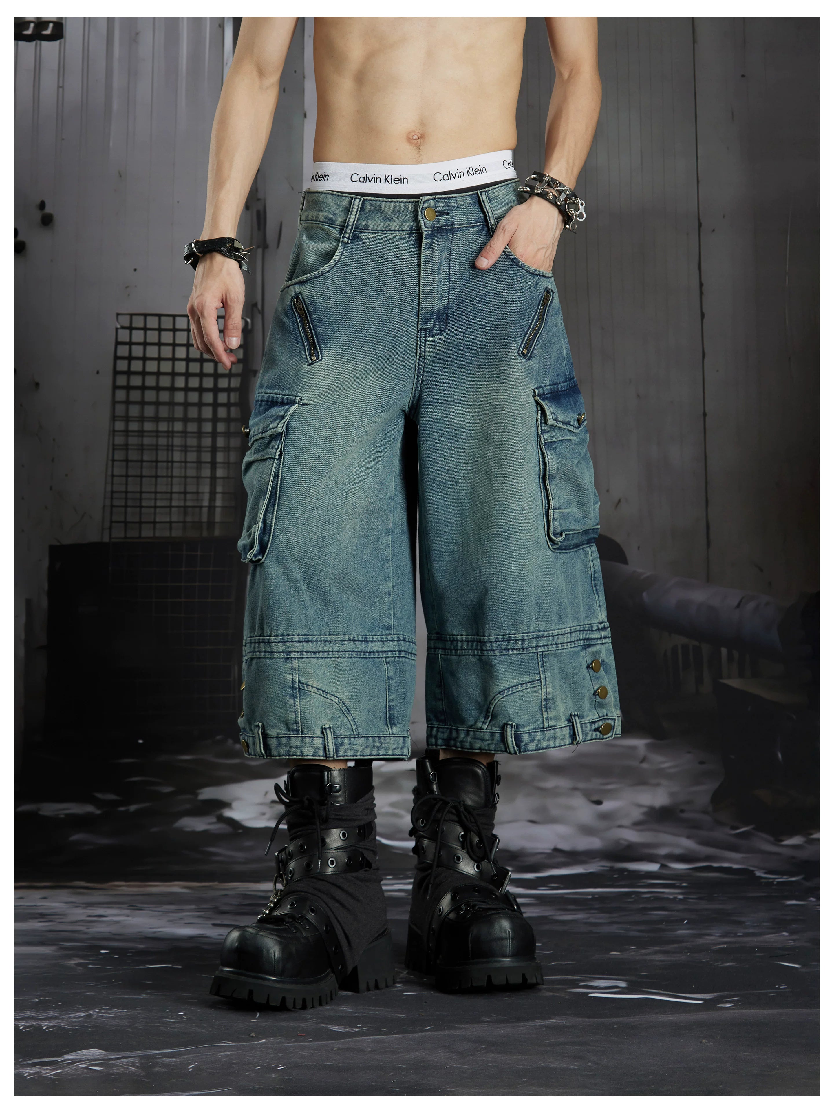 NOMANIAI  Washed, distressed, loose-fit cropped pants with multiple pockets.